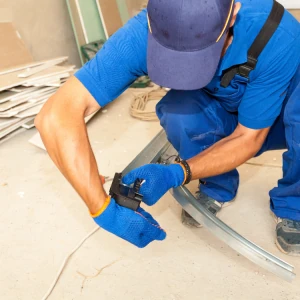 DYG Garage Doors technician handling a garage door part