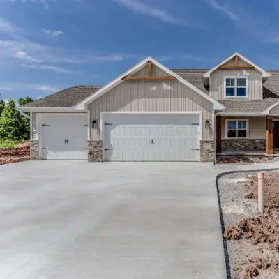 Garage-Doors Modern suburban home with two white paneled garage doors